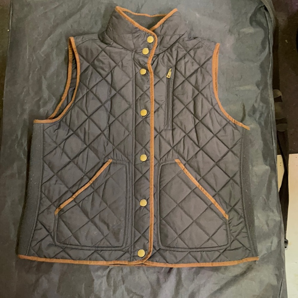 Used brown and black WOMENS vest it is in good condition